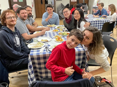 Happy diners around a table eating